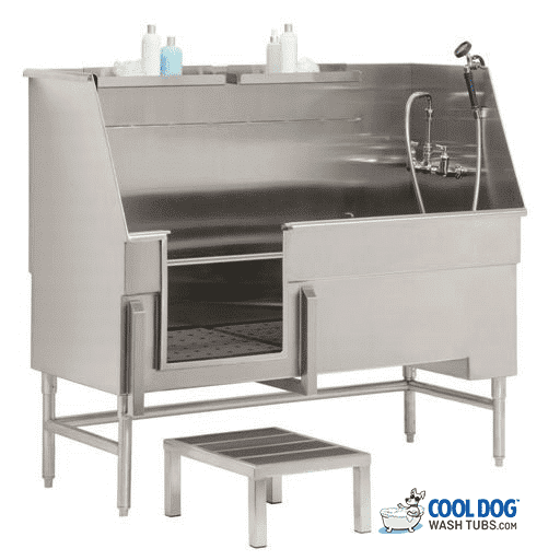 A stainless steel dog wash tub with a step stool, faucet, and handheld sprayer. Bottles of soap or shampoo are placed on a shelf above the tub. Cool Dog Wash Tubs logo is in the bottom right corner.