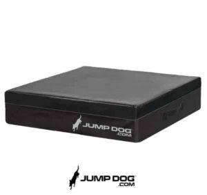 A black, square Jump Dog SUV Pet Comfort Pad with the "Jump Dog" logo and website on its side sits on a white background. The logo, showing a jumping dog silhouette, appears below the pad.