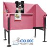 A black and white dog stands in a pink Cool Dog Wash Tub - Architectural Series (LSP) with a towel draped over the front. Below, "COOL DOG WASH TUBS" appears, alongside a cartoon dog in a tub.