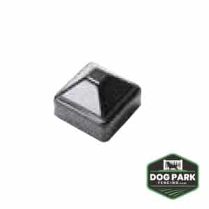 A glossy black Top Fence Post Cap with a sleek pyramid design. The bottom right corner displays a green and black "Dog Park Fencing" logo.