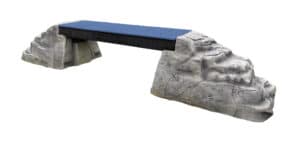 Ellie's Boulder Bridge Pro features a blue, flat, textured bridge connecting two artificial gray rocks with bumper pads, making it an engaging Dog Park element for pet exercise and training.