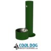 A green outdoor drinking fountain with a round basin and a vertical column, designed for dogs, with "Cool Dog Water Fountains" and a dog logo displayed below.