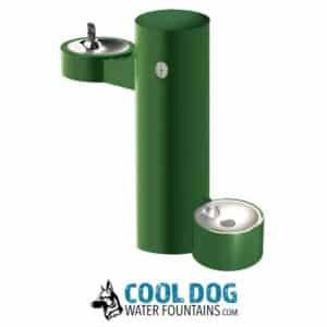 A green outdoor water fountain with two basins at different heights, one for people and one for dogs, with the logo "Cool Dog Water Fountains" and a German Shepherd illustration below.
