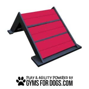 A red and black A-frame dog agility ramp with the text "Play & Agility Powered by GymsForDogs.com" and a paw print logo at the bottom.