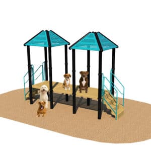 Four dogs are sitting and standing on and around a playground structure with two blue-roofed platforms connected by a bridge, situated on a sandy surface.