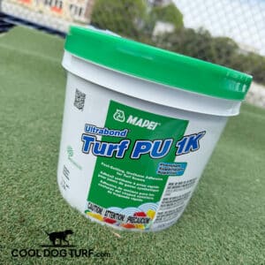 A container of MAPEI Ultrabond Turf PU 1K adhesive with a green lid sits on artificial grass. The label highlights fast-setting features and caution warnings. "COOL DOG TURF" logo appears at the bottom left.