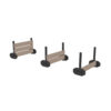 Three stages of a gym sled with brown and black parts, shown from left to right: fully assembled with all boards, middle stage with fewer boards, and final stage with just the base and handles on a white background.